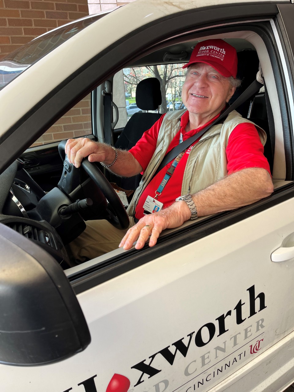 Dick driving a Hoxworth van as a volunteer